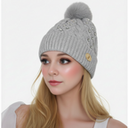 Woman's knitted bedazzled pom pom hat