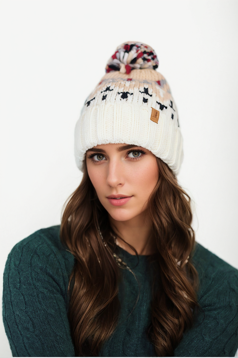 Woman's knitted winter beanie hat with pom pom