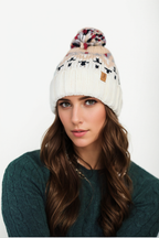 Woman's knitted winter beanie hat with pom pom