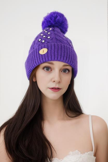 Woman's knitted bedazzled pom pom hat