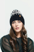 Woman's knitted winter beanie hat with pom pom